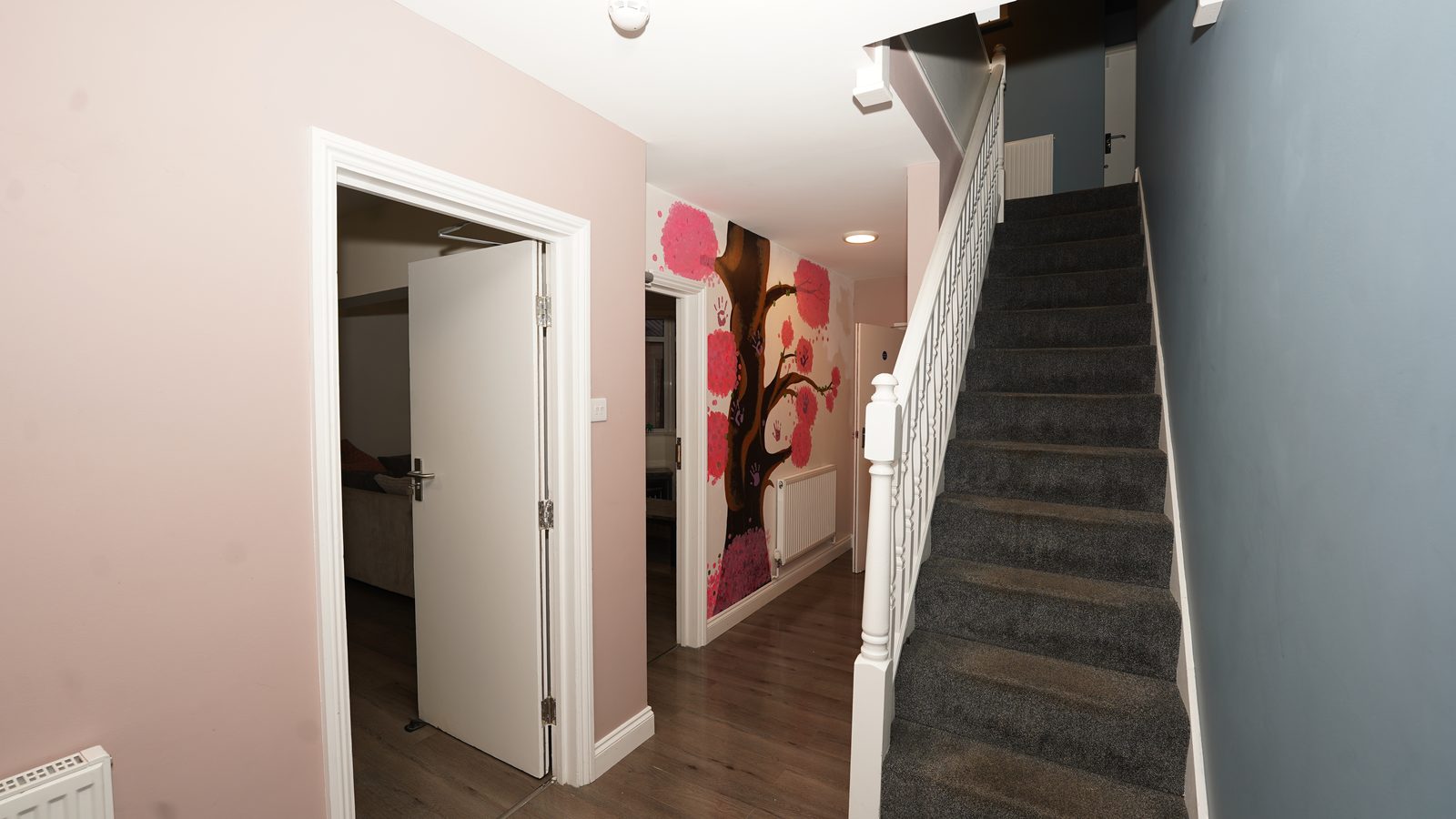 Welcoming hallway & stairs at Lisette House